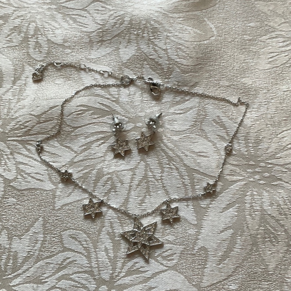 Swarovski star crystal necklace with matching drop earrings.